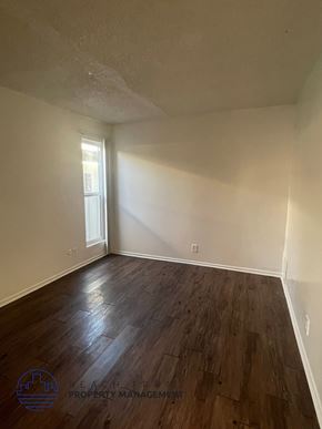 Lynwood apartment for rent - A room with wooden flooring and a window letting in light.