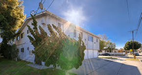 Long Beach apartment for rent - A white building with a tree in front of it.