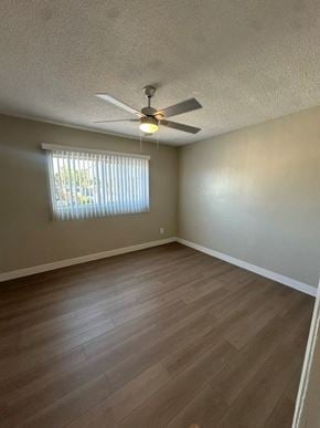 Anaheim apartment for rent - A room with a ceiling fan and a window with blinds.