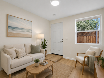 Long Beach apartment for rent - A living room with a couch, a chair, a coffee table, and a painting on the wall.