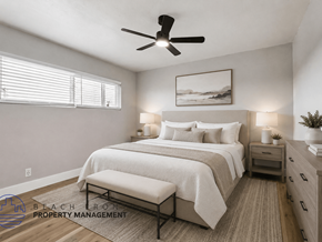 Lomita apartment for rent - A well-lit bedroom with a large bed, a bench, and a ceiling fan.