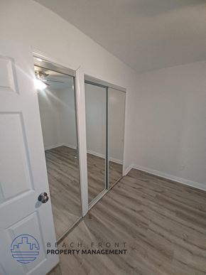Long Beach apartment for rent - a bedroom with a closet and a mirrored closet door