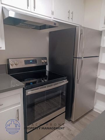 Long Beach apartment for rent - a kitchen with a stove and a refrigerator
