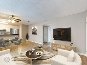 Paramount apartment for rent - A living room with a television, a sofa, and a coffee table.