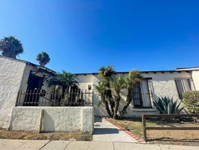 Wilmington apartment for rent - a house with palm trees in front of it
