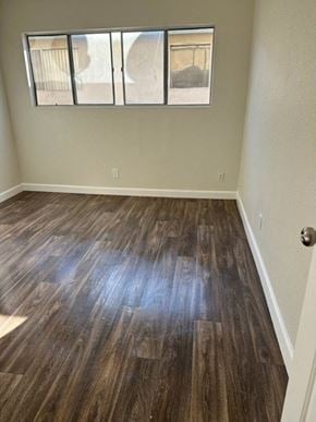 Downey apartment for rent - an empty room with wooden floors and a window