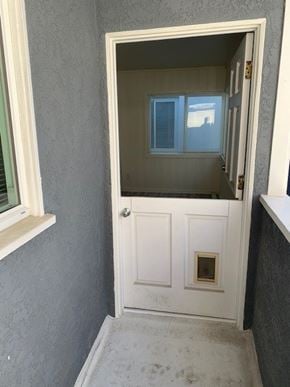 Hermosa Beach apartment for rent - A white door with a window above it in a room.