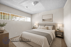 Inglewood apartment for rent - A well-lit bedroom with a large bed and a framed picture on the wall.