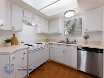 Whittier apartment for rent - A kitchen with white cabinets and a stainless steel dishwasher.