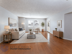 Whittier apartment for rent - A well-lit living room with a couch, coffee table, and a plant.