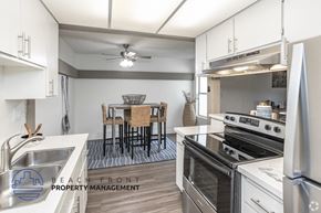 Westminster apartment for rent - A modern kitchen with a dining table set up.