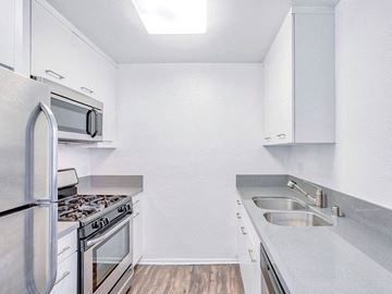 Los Angeles apartment for rent - a kitchen with stainless steel appliances and white cabinets