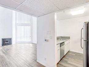 Los Angeles apartment for rent - an empty kitchen and living room with a stove and refrigerator