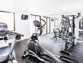 Los Angeles apartment for rent - a gym with weights and cardio equipment in a home gym