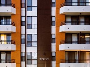 Los Angeles apartment for rent - a row of apartment buildings with windows and balconies