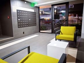 Los Angeles apartment for rent - the lobby of a building with yellow chairs