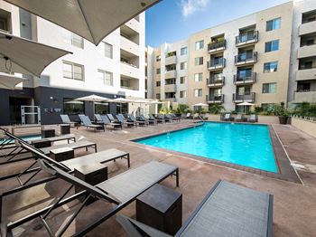 Sparkling blue pool and lounge chairs 