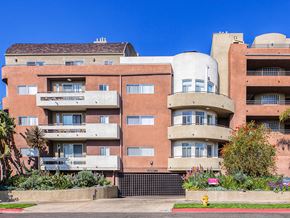 Los Angeles apartment for rent - a large apartment building with balconies and a fire hydrant