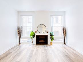 Los Angeles apartment for rent - a living room with a fireplace and a mirror in it