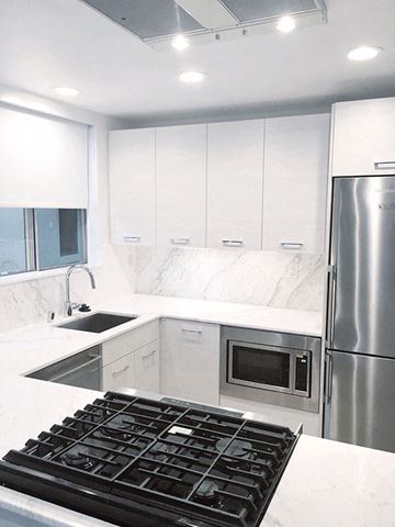 Los Angeles apartment for rent - a white kitchen with a stove and a refrigerator