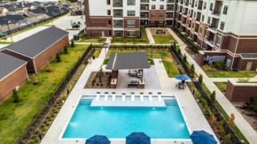 Celina apartment for rent - an aerial view of a swimming pool in front of an apartment building