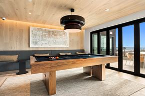 San Diego apartment for rent - A pool table is in the middle of a room with a view of the ocean.