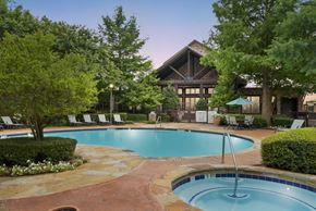 Arlington apartment for rent - a swimming pool with a hotel in the background