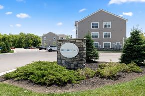 South Lyon apartment for rent - A sign that says Westlake Place in front of a building.