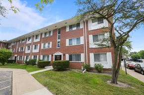 Skokie apartment for rent - a brick apartment building with a sidewalk in front of it