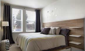Longmont apartment for rent - a bedroom with a bed and two windows
