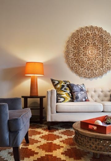 Longmont apartment for rent - a living room with a white couch and a chair and a lamp
