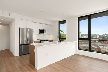 Los Angeles apartment for rent - A modern kitchen with a stainless steel refrigerator and a microwave oven.