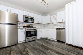 Phoenix apartment for rent - a kitchen with white cabinets and stainless steel appliances