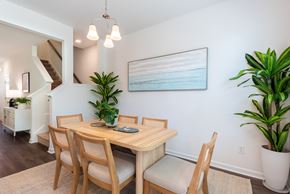 Goose Creek townhouse for rent - A dining room with a wooden table and chairs.