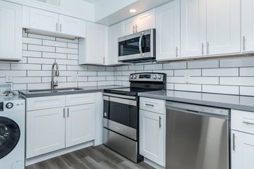 Phoenix apartment for rent - a kitchen with white cabinets and stainless steel appliances