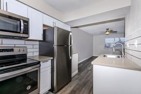 Glendale apartment for rent - a kitchen with stainless steel appliances and white cabinets