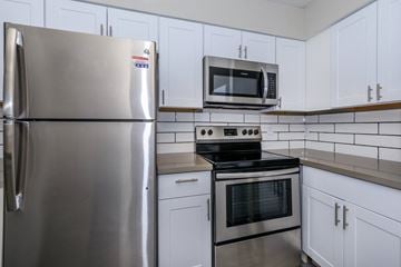 Glendale apartment for rent - a kitchen with stainless steel appliances and white cabinets