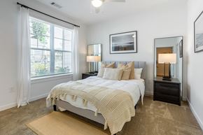 Atlanta apartment for rent - a bedroom with a bed and a large window