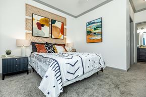 San Antonio apartment for rent - a bedroom with a bed and paintings on the wall