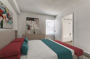 Longview apartment for rent - a bedroom with a bed and a door to a bathroom