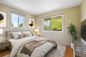 Skokie apartment for rent - a bedroom with a bed and two windows
