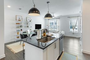 Atlanta apartment for rent - an open kitchen and living room with a sink and a counter top
