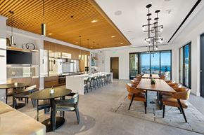 San Diego apartment for rent - A modern dining room with a long table and chairs.