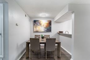 Smyrna apartment for rent - a dining room with a wooden table and chairs
