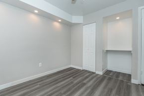 Phoenix apartment for rent - a living room with grey walls and a white door
