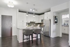 Lone Tree apartment for rent - A kitchen with a table and chairs in the middle.