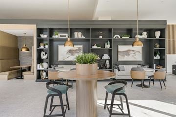 Skokie townhouse for rent - A modern living room with a dining table and chairs.