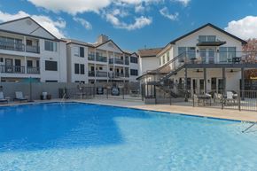 Austin apartment for rent - a large swimming pool in front of an apartment building