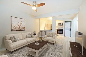 Phoenix apartment for rent - A living room with a white couch and a coffee table.