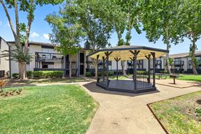 Houston apartment for rent - a gazebo with trees and apartments in the background
